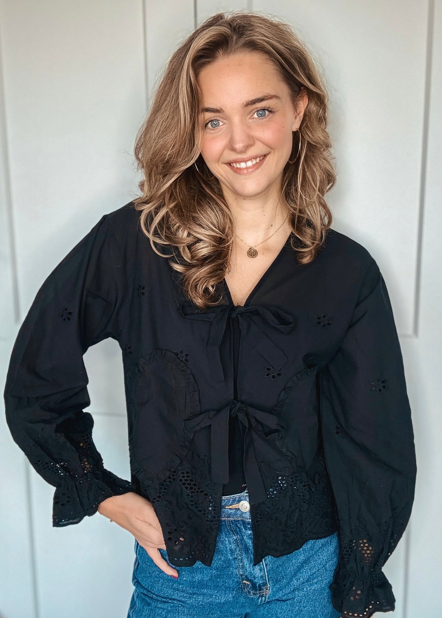 Zwarte top met strikdetail